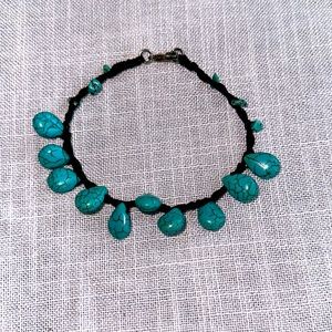 Bracelet turquoise teardrop and chip beads with braided brown leather 8 1/2”